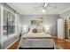 Bedroom with hardwood floors, bright window, and large bed with lamps at 3777 Peachtree Ne Rd # 1216, Atlanta, GA 30319