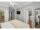 Bedroom features closet, TV, and door to kitchen and living area at 3777 Peachtree Ne Rd # 1216, Atlanta, GA 30319