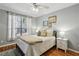 Bedroom with hardwood floors and a bright window and lamps at 3777 Peachtree Ne Rd # 1216, Atlanta, GA 30319
