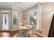 Bright breakfast nook with hardwood floors, two large windows, and a door to the outside at 3777 Peachtree Ne Rd # 1216, Atlanta, GA 30319