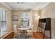 Charming breakfast area with hardwood flooring, natural light, and stylish light fixture at 3777 Peachtree Ne Rd # 1216, Atlanta, GA 30319