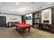 Community game room featuring a pool table, tv, shelves and work space at 3777 Peachtree Ne Rd # 1216, Atlanta, GA 30319