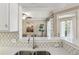 Kitchen view looking into the living area, featuring marble countertops and a stainless steel sink at 3777 Peachtree Ne Rd # 1216, Atlanta, GA 30319