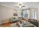 Inviting living room with seating, natural light from the window and light hardwood floors at 3777 Peachtree Ne Rd # 1216, Atlanta, GA 30319