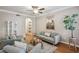 Spacious living room features hardwood floors, neutral walls, and an open archway at 3777 Peachtree Ne Rd # 1216, Atlanta, GA 30319
