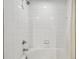 White tiled shower featuring a shower head and handle at 3777 Peachtree Ne Rd # 1216, Atlanta, GA 30319