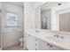 Bathroom featuring a double sink vanity, large mirror, and tile flooring at 4100 Paces Se Walk # 3205, Atlanta, GA 30339