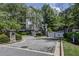 Elegant gated entrance to a private property with manicured landscaping and a paver driveway at 4100 Paces Se Walk # 3205, Atlanta, GA 30339