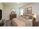 This primary bedroom boasts neutral walls, modern décor, and a comfortable bedroom set at 45 Chimney Ridge Ln, Covington, GA 30014