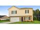 Charming two-story home featuring a brick facade, attached garage, and well-maintained lawn at 45 Chimney Ridge Ln, Covington, GA 30014