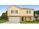Charming two-story home featuring a brick facade, attached garage, and well-maintained lawn at 45 Chimney Ridge Ln, Covington, GA 30014