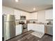 Well-equipped kitchen featuring stainless steel appliances, granite countertops, and ample cabinet space at 45 Chimney Ridge Ln, Covington, GA 30014