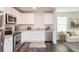 Modern kitchen featuring stainless steel appliances, granite countertops, and elegant white cabinets at 45 Chimney Ridge Ln, Covington, GA 30014