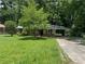 Charming brick home with a lush green front yard and a covered carport providing convenient parking at 2014 Brannen Se Rd, Atlanta, GA 30316