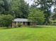 Traditional brick home featuring a well-maintained lawn, mature trees, and classic window shutters at 2014 Brannen Se Rd, Atlanta, GA 30316