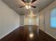 Bright living room with dark hardwood floors, white walls, and a ceiling fan for year-round comfort at 2014 Brannen Se Rd, Atlanta, GA 30316