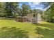 Expansive backyard featuring a cozy screened porch, a wooden deck, and a patio for outdoor relaxation at 231 Cross Gate Dr, Marietta, GA 30068