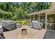 This backyard has a cozy fire pit and multiple grills covered for use at 231 Cross Gate Dr, Marietta, GA 30068