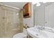 Modern bathroom with glass shower enclosure, wooden vanity, and updated fixtures at 231 Cross Gate Dr, Marietta, GA 30068