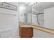 Bright bathroom featuring double sinks with granite countertops and mirrored wall at 231 Cross Gate Dr, Marietta, GA 30068