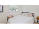 This is a bedroom with natural light and a small side table next to the bed at 231 Cross Gate Dr, Marietta, GA 30068