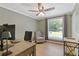 Cozy office space with a large window, wooden desk and comfortable seating at 231 Cross Gate Dr, Marietta, GA 30068