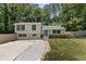 Charming split level with well-manicured lawn and driveway at 231 Cross Gate Dr, Marietta, GA 30068