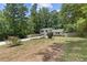 Charming home with well-maintained lawn, mature trees, and convenient driveway at 231 Cross Gate Dr, Marietta, GA 30068