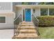Inviting front entrance with stone steps leading to a bright blue door and stylish railing at 231 Cross Gate Dr, Marietta, GA 30068