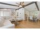 Spacious living room with hardwood floors, wooden ceiling beams, and adjacent dining area at 231 Cross Gate Dr, Marietta, GA 30068