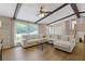 Inviting living room with hardwood floors, ceiling beams, and ample natural light at 231 Cross Gate Dr, Marietta, GA 30068