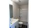 Well-lit bathroom boasts a vanity, toilet, and tub/shower combination at 3536 Dogwood Pass, Lithonia, GA 30038