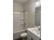 Bright bathroom with white vanity, tub-shower combination, and modern fixtures at 3536 Dogwood Pass, Lithonia, GA 30038