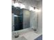 Elegant bathroom featuring double sinks, large mirror, and modern lighting fixtures at 3536 Dogwood Pass, Lithonia, GA 30038