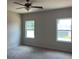 Spacious bedroom with neutral walls, carpet, and two windows for natural light at 3536 Dogwood Pass, Lithonia, GA 30038