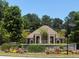 Community clubhouse surrounded by lush landscaping at 3536 Dogwood Pass, Lithonia, GA 30038