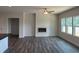 Open concept living room with fireplace and plenty of natural light at 3536 Dogwood Pass, Lithonia, GA 30038