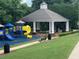 Community playground featuring swings, slides, and a covered picnic area at 3536 Dogwood Pass, Lithonia, GA 30038