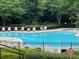 Bright and clean community pool with ample seating and landscaping at 3536 Dogwood Pass, Lithonia, GA 30038