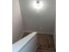 Carpeted staircase with white railing provides access to upper or lower levels at 3536 Dogwood Pass, Lithonia, GA 30038
