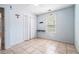 Well-lit bedroom features neutral tile flooring, and a closet for ample storage space at 55 Ashland Farm Rd, Oxford, GA 30054
