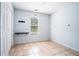 Tiled bedroom features a window for natural light, a closet, and light blue walls at 55 Ashland Farm Rd, Oxford, GA 30054
