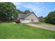 View of the house with a 2-car garage and a well-maintained lawn at 55 Ashland Farm Rd, Oxford, GA 30054
