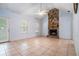 Spacious living room featuring a stone fireplace, and tile flooring creating a cozy atmosphere at 55 Ashland Farm Rd, Oxford, GA 30054
