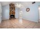 Spacious living room featuring a stone fireplace, and tile flooring creating a cozy atmosphere at 55 Ashland Farm Rd, Oxford, GA 30054