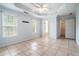 Spacious main bedroom features a tray ceiling, ceiling fan, and tiled floors at 55 Ashland Farm Rd, Oxford, GA 30054