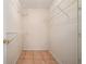 A compact walk-in closet featuring tiled flooring and shelving at 55 Ashland Farm Rd, Oxford, GA 30054
