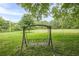 Large backyard featuring a swing and a expansive, fenced-in lawn at 5709 Center Hill Church Rd, Loganville, GA 30052