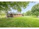 Expansive backyard featuring a well-maintained lawn and mature trees at 5709 Center Hill Church Rd, Loganville, GA 30052