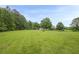 Spacious backyard, complemented by mature trees, creating a serene setting at 5709 Center Hill Church Rd, Loganville, GA 30052